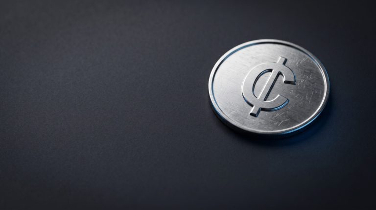Physical Hedera HBAR coin on neutral dark surface